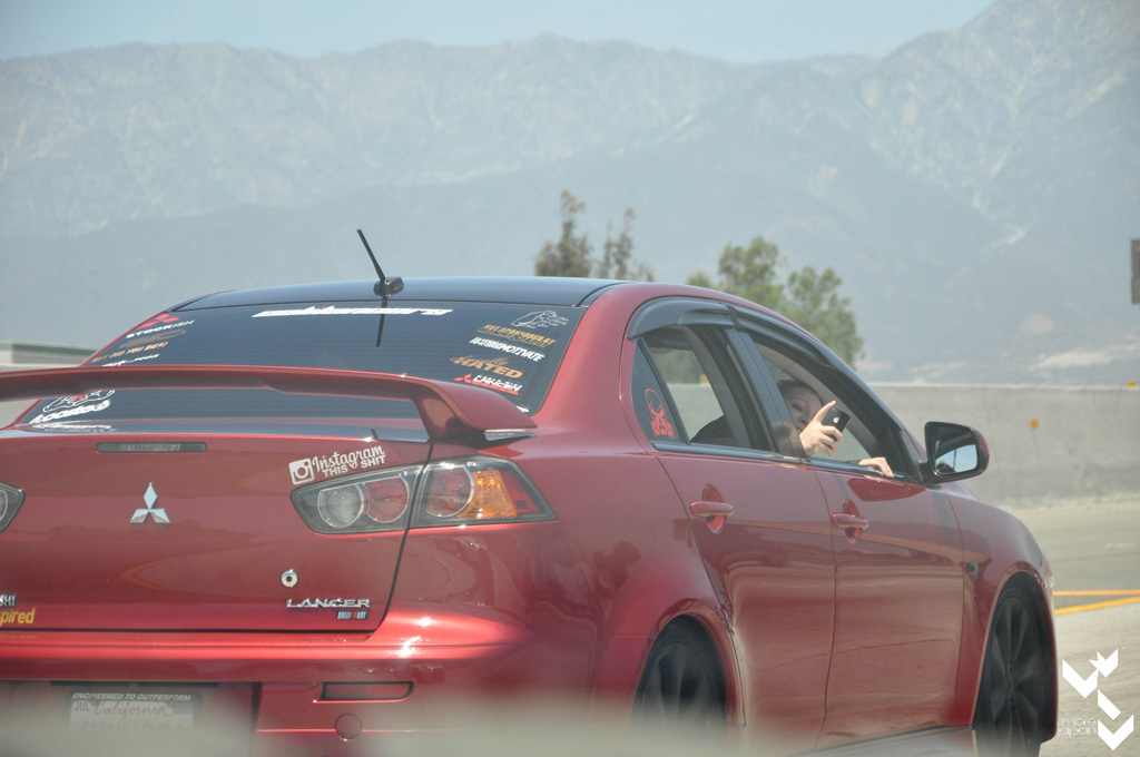 Saw a lot of people taking pictures of the cars in the rally.